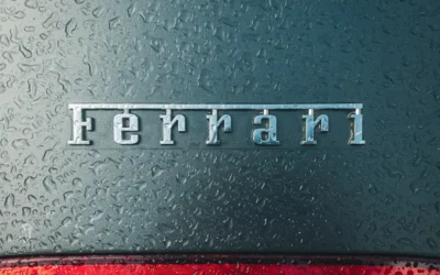 a close up of the word ferrari on the side of a car