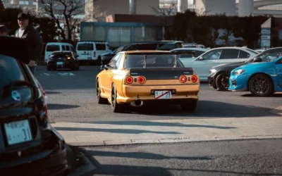 Yellow sports car with spoiler in parking lot