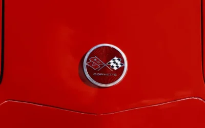 a close up of the emblem on a red sports car