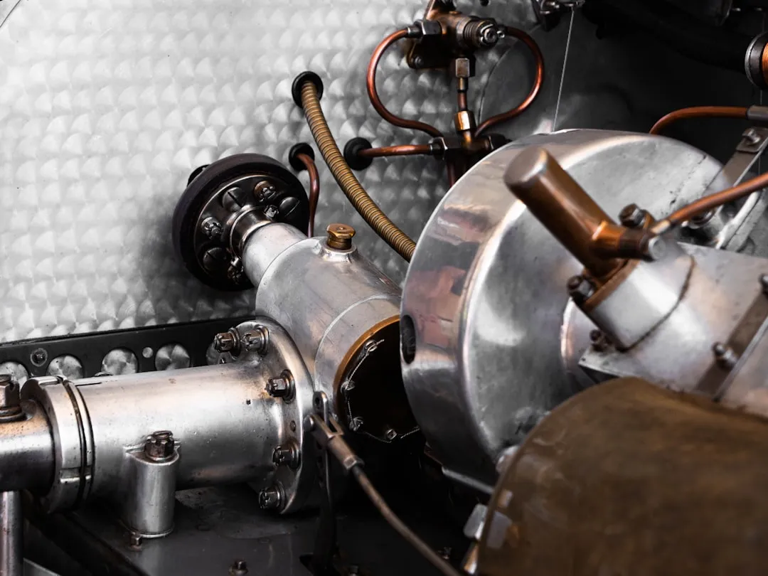 Engine parts of an old vehicle are shown.