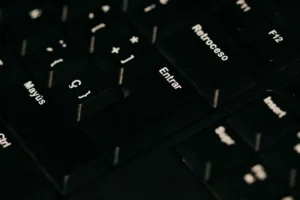 a close up of a black keyboard with white letters