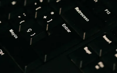 a close up of a black keyboard with white letters
