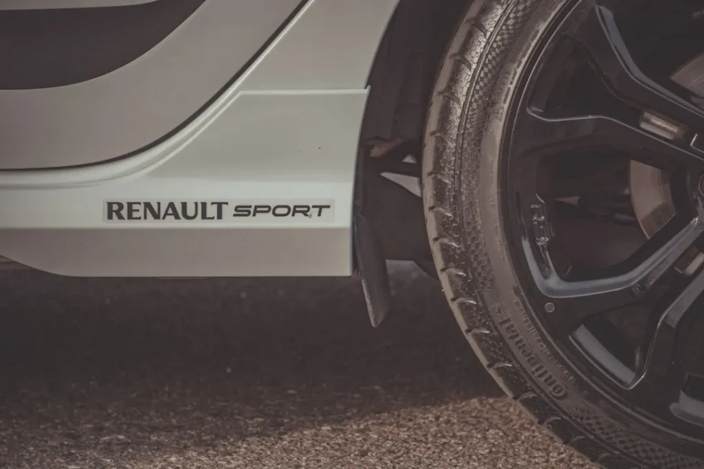white and black car on road