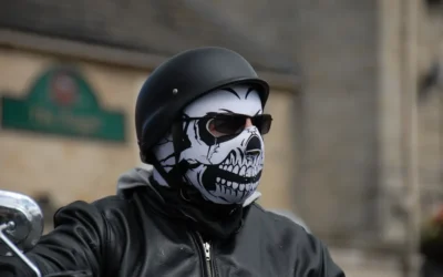 a man wearing a skeleton mask and black leather jacket